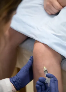 A Marietta College Physician Assistant Studies graduate student uses a syringe.